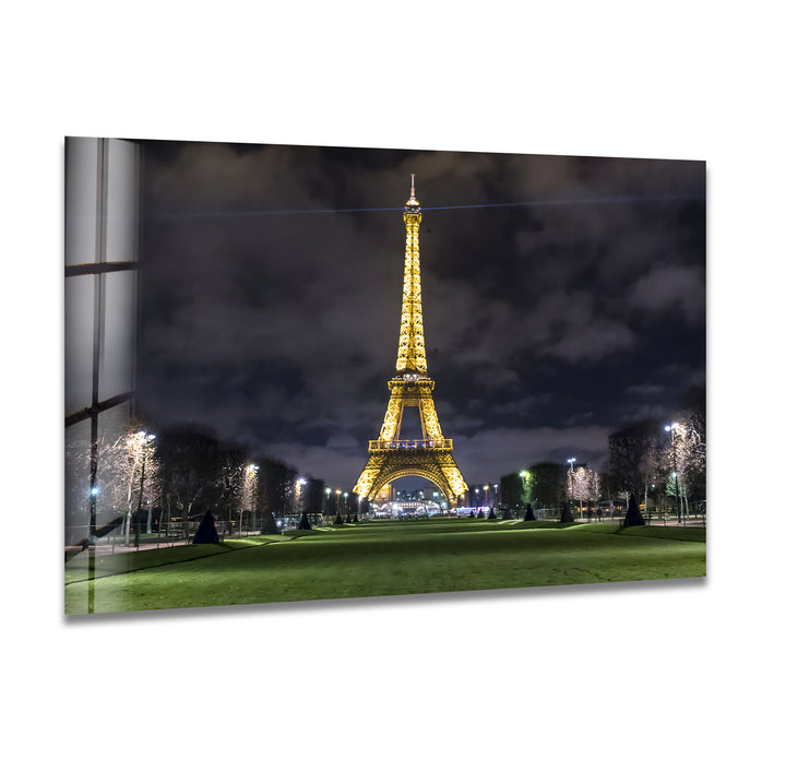 Eiffel Tower at Night: Illuminated Landmark on Glass Wall Art
