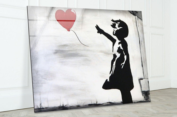 Banksy Girl with Balloon Glass Wall Art - Transform your home with Banksy Glass Wall Arts! Our high-quality, vibrant designs on reinforced tempered glass bring life and color to any room. Enjoy custom options, easy installation, and free shipping. Make your walls a reflection of your style and personality. Shop now for a stunning home decor upgrade!