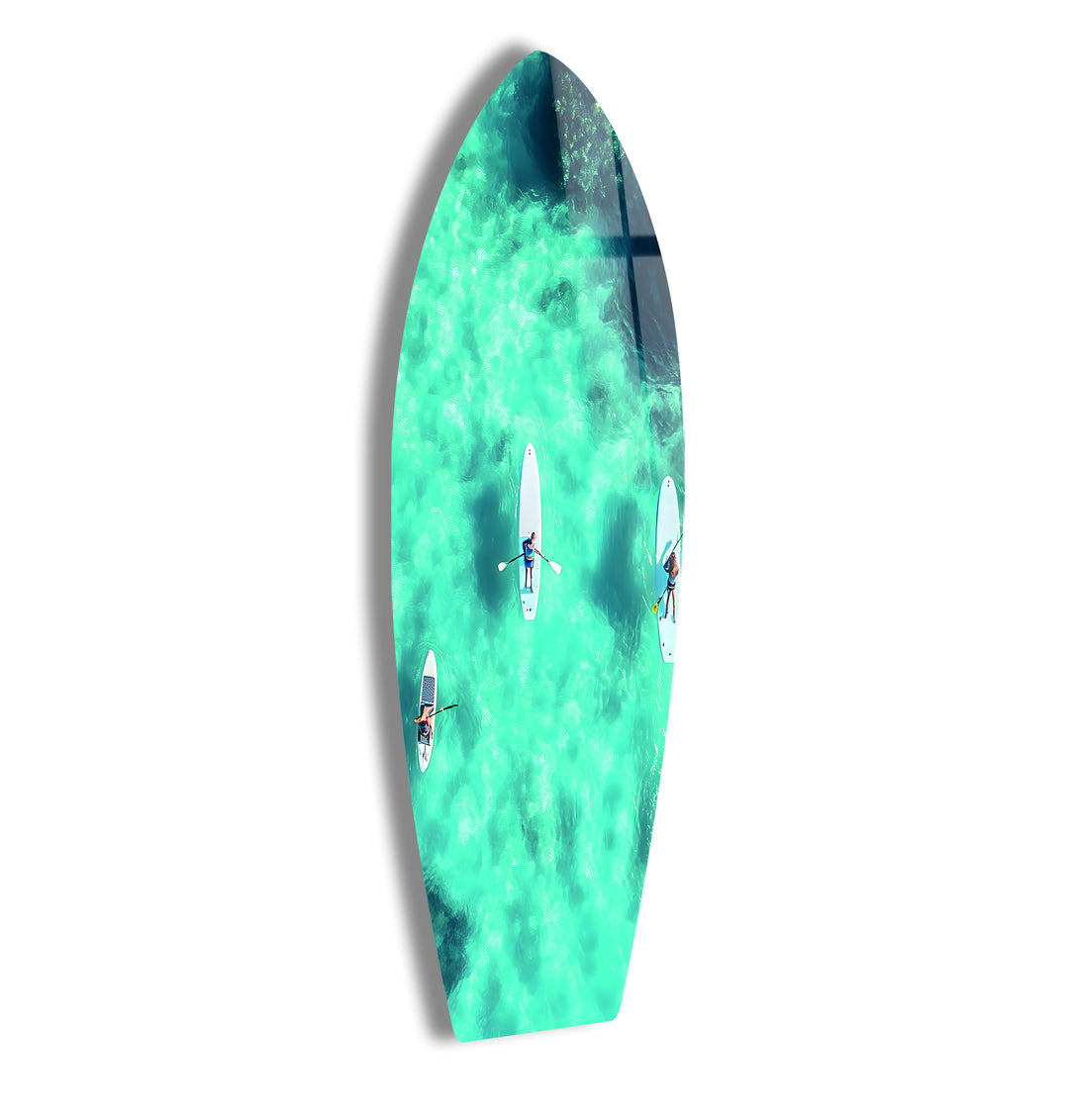 Serene Paddleboarding Art: Glass wall art capturing the peaceful movement of paddleboarders in tranquil waters.
