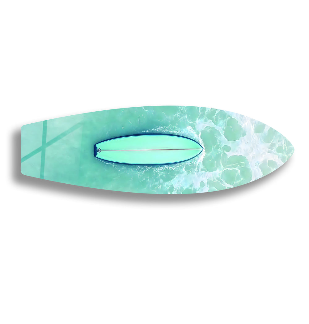 Aerial view of a paddleboarder gliding through clear turquoise waters, captured in stunning glass art.
