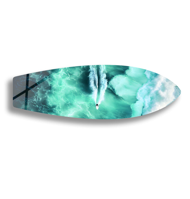 Aerial view of a paddleboarder gliding through crystal-clear turquoise waters, captured in stunning glass art.