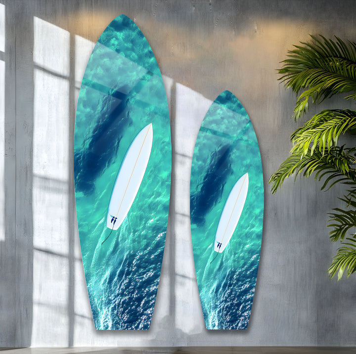 Surfer paddling on a tranquil ocean, captured from above in vibrant, high-quality glass wall art.
