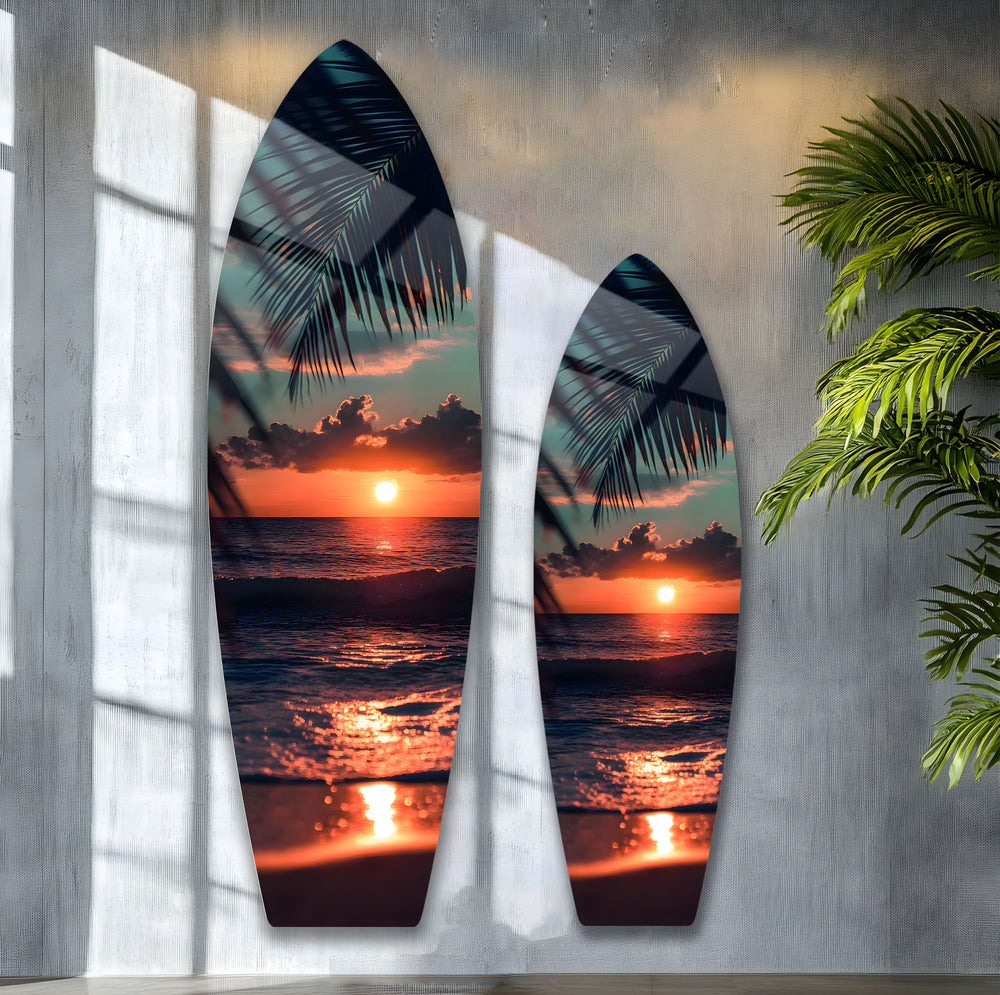 Tropical Beach Sunset Art: Stunning glass wall art showcasing the beauty of a sunset over the ocean with a palm tree silhouette.
