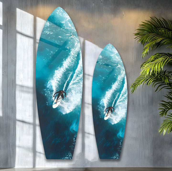 A captivating glass wall art piece, featuring a surfer carving through a powerful wave.
