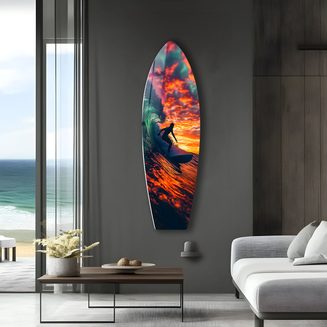 Stunning glass wall art depicting a surfer riding powerful waves at sunset.
