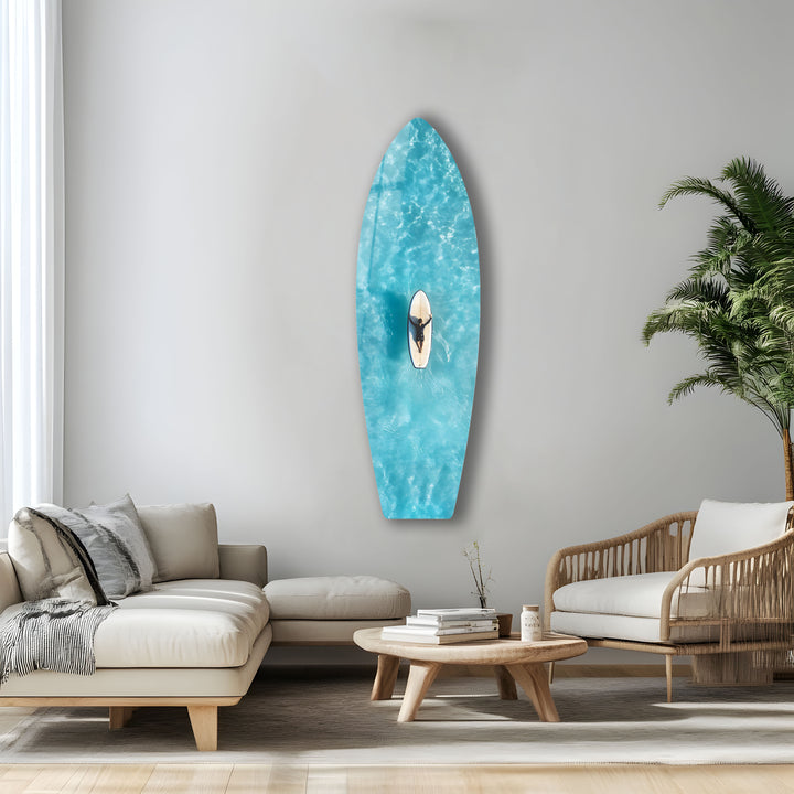 Peaceful surfing moment in clear waters, captured from above in ultra-sharp glass wall art.
