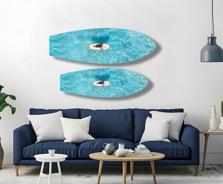 Surfer enjoying the tranquility of the ocean, with stunning aerial views portrayed in vibrant glass art.
