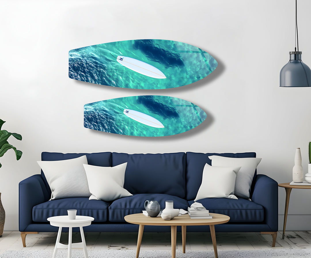 Serene moment of a surfer in turquoise waters, depicted in vibrant glass wall art for beach lovers.
