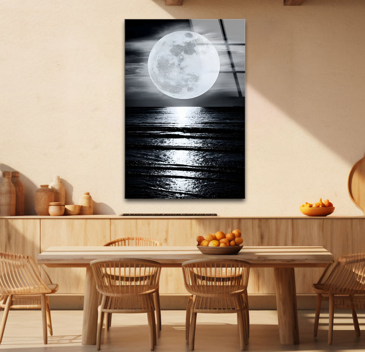 Bold black and white framed art of a glowing full moon, creating a striking focal point for your walls.