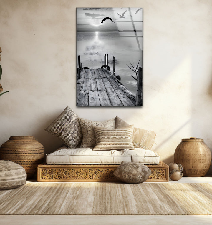 Refined black and white framed art showcasing the timeless beauty of a dock and water scene.