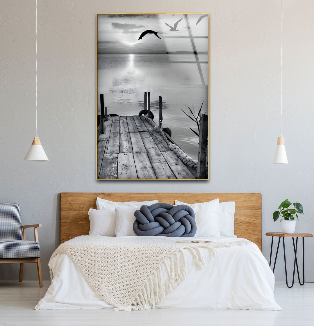 Unique black and white wall decor featuring a dock leading to a serene and peaceful setting.