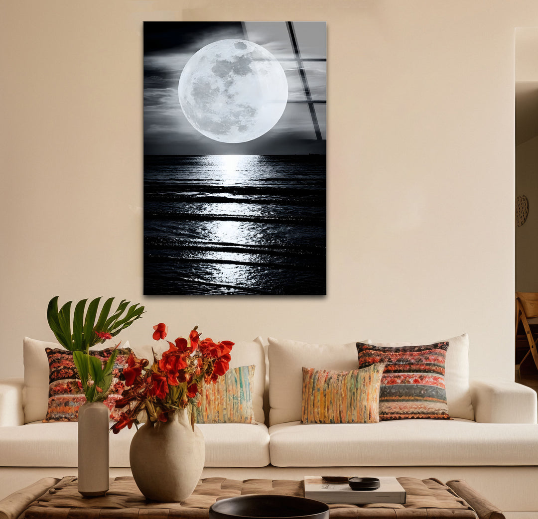 Stylish black and white paintings of a glowing moon over still waters, perfect for a calming ambiance.