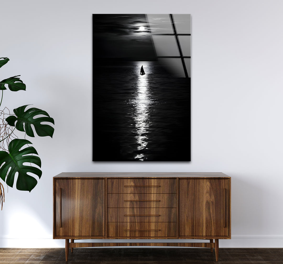 Modern black and white wall decor highlighting a peaceful landscape illuminated by the moon.