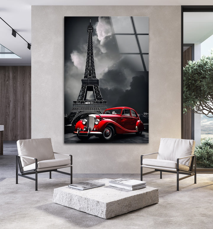 A beautiful black and white tribute to Paris, featuring a red vintage car and the majestic Eiffel Tower.

