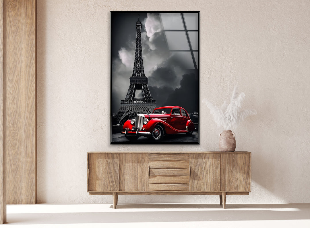 A striking blend of history and beauty, this artwork features a classic red car in front of the Eiffel Tower in elegant black and white.

