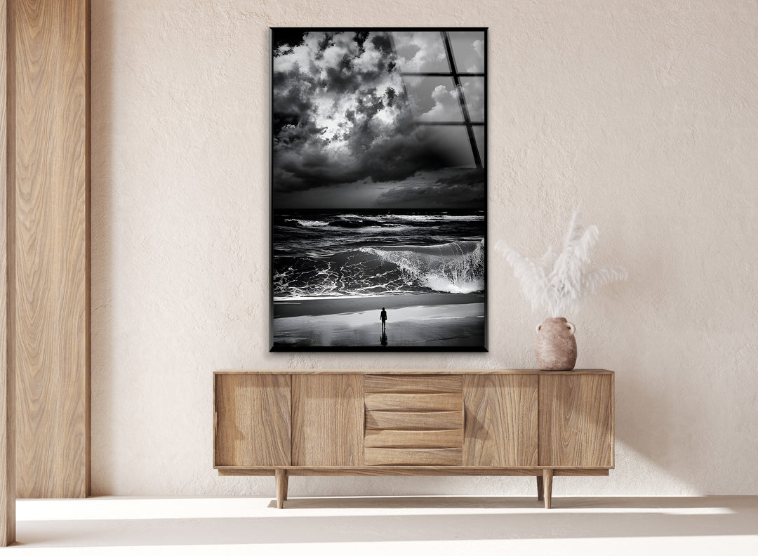 A striking black and white artwork portraying the contrast between stormy clouds and ocean waves.

