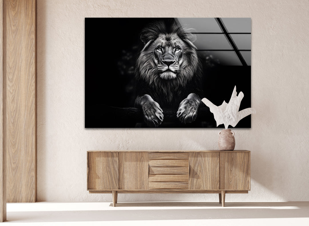 Majestic lion gazing forward, captured in stunning black-and-white glass wall art.
