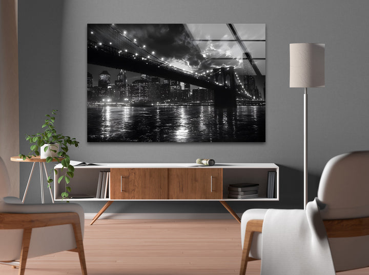 Modern architectural glass wall art displaying the lights and reflections of New York’s Brooklyn Bridge.
