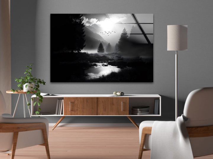 Captivating black and white glass wall art showcasing a mystical forest and distant mountains under soft moonlight.
