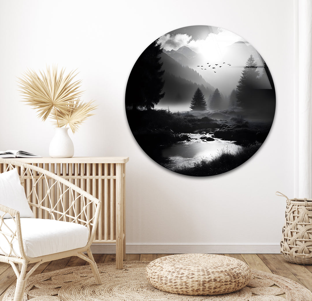 A dramatic monochrome landscape of mountains and forests, creating a striking effect on glass wall art.
