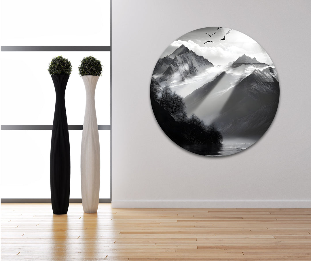 Modern glass wall art featuring a dramatic black-and-white mountain landscape.