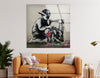 a living room with a couch and a painting on the wall - Artdesigna Glass Printing Wall Arts - Large Banksy Wall Art