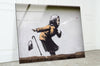 Banksy Sneezing Woman Glass Wall Art - Explore Banksy prints for sale and add a vibrant, artistic touch to any room. Our collection includes Banksy wall art, original art for sale, and more. Purchase Banksy art to enjoy high-quality prints and unique designs that bring life to your walls.