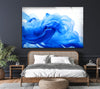 a bedroom with a large blue painting on the wall
