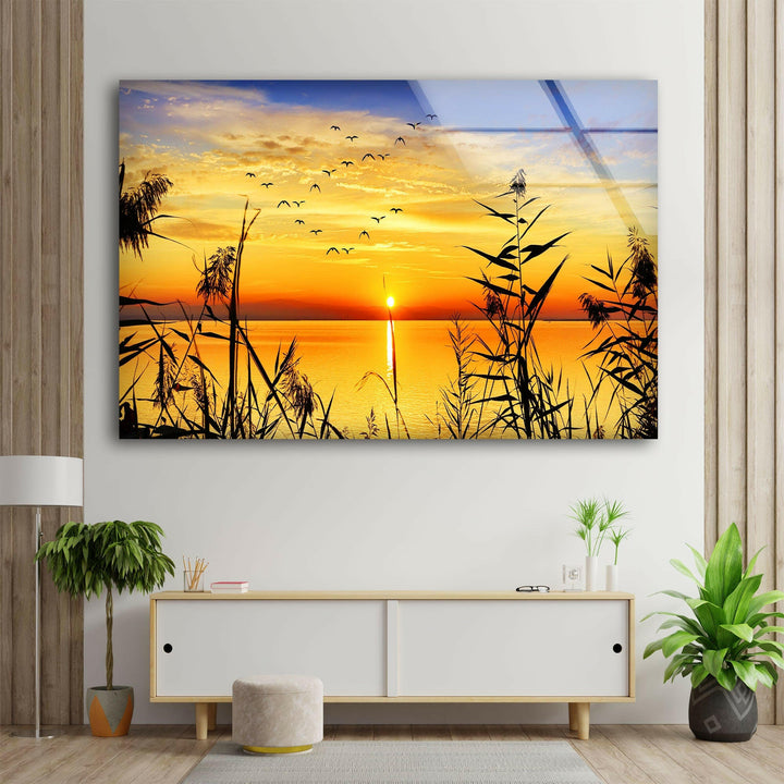 Grass Upon Water By Sunset Glass Wall Art