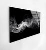 a black and white photo of smoke on a wall